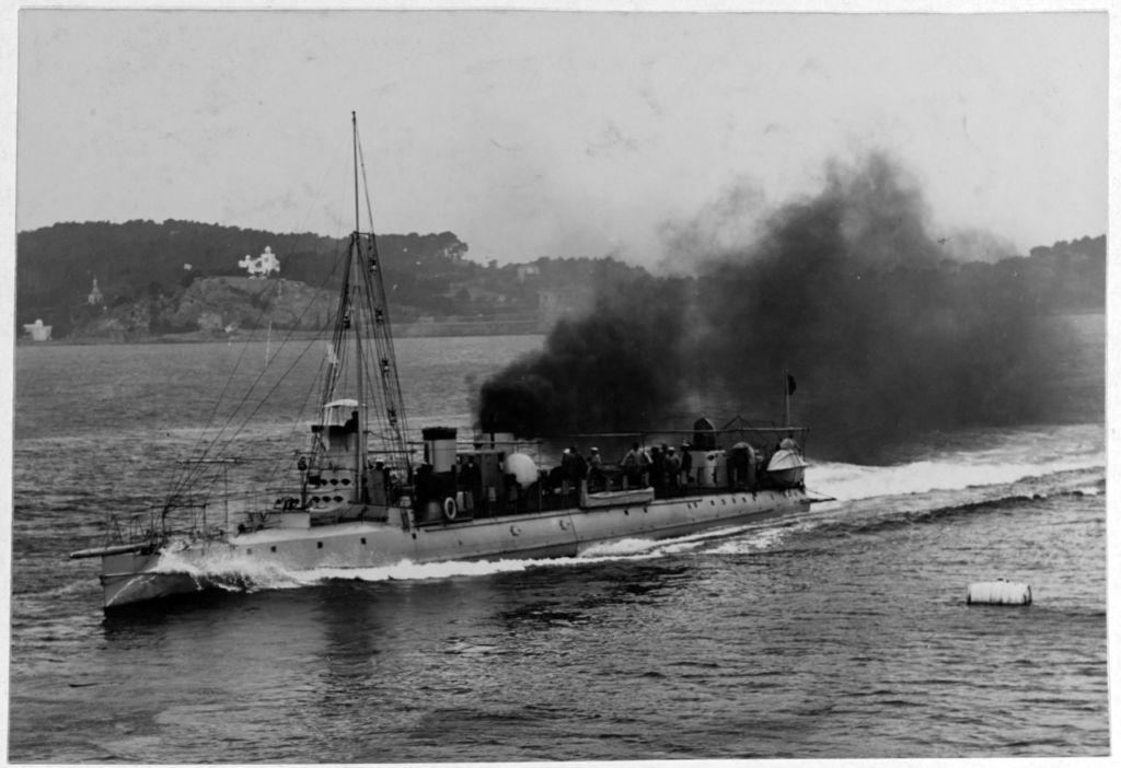 French torpedo boat Cyclone. It's belting along at a fair pace, with masses of black smoke rolling away from the otherwise fairly standard small, fast ship of the time. It looks like a slightly smaller destroyer - a ship type that evolved to counter it.