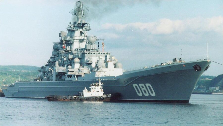 Russian cruiser Admiral Nakhimov being attended to by a tug